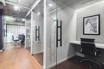 Modern conference room with glass walls and black accents